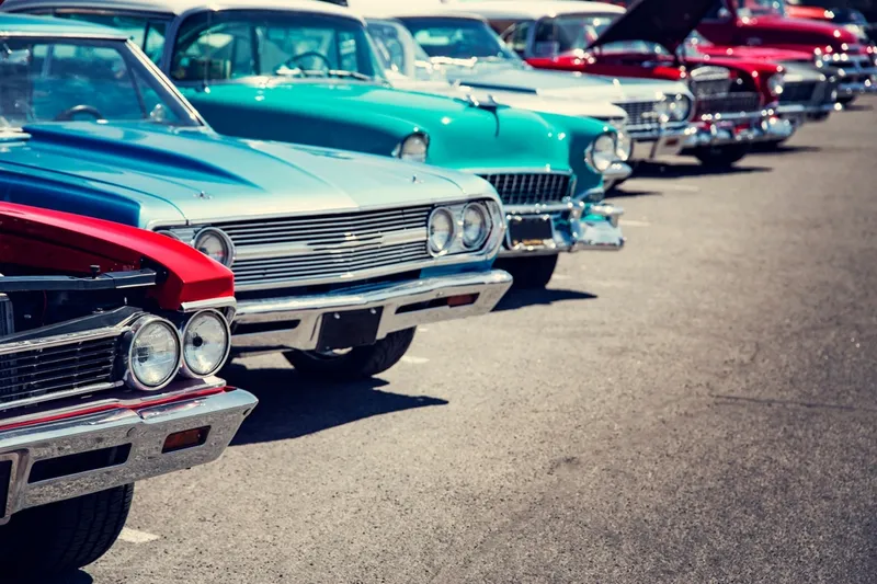 vintage cars lined up at show