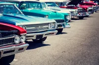 vintage cars lined up at show