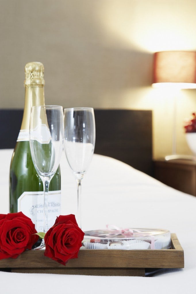 Romantic room setting with roses and champagne