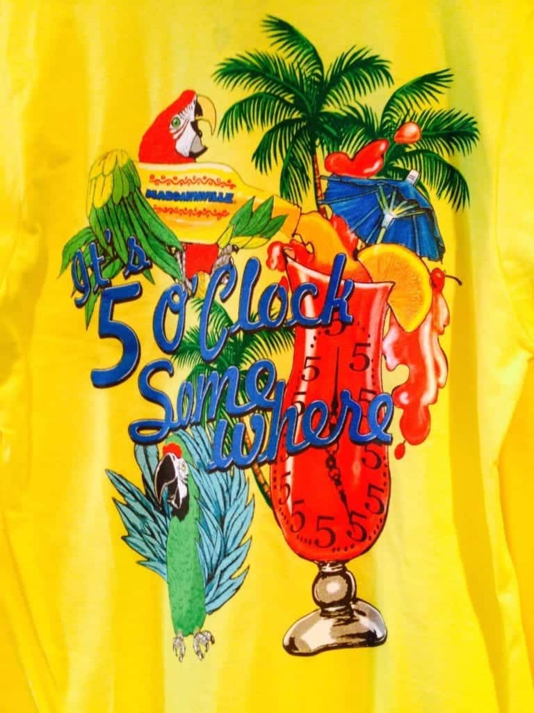 Back of yellow shirt that says It's 5 o'clock somewhere