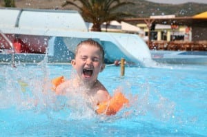 Kid splashing in a pool