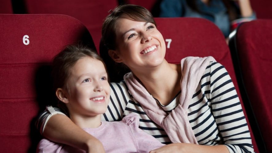 Mother and daughter watching a movie