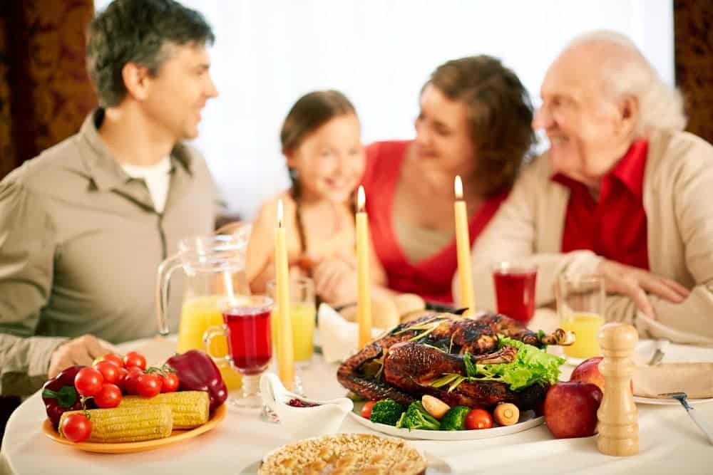 Family getting ready to enjoy Thanksgiving dinner
