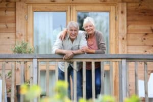 Mature couple smiling from a Gatlinburg cabin deck