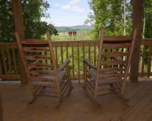 rocking chairs on back deck of Pigeon Forge Cabin Rentals Close To Parkway