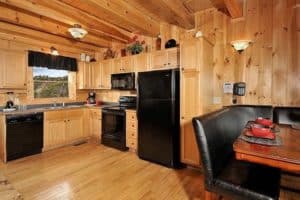 Fully furnished kitchen in the Peek-a-View cabin in the Smoky Mountains.