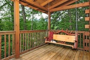 Outdoor swing on the portch of an affordable cabin in the Smokies