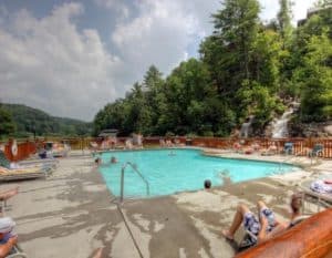 Vacationers enjoying the Bear Creek Crossing Resort pool in the Smoky Mountains.