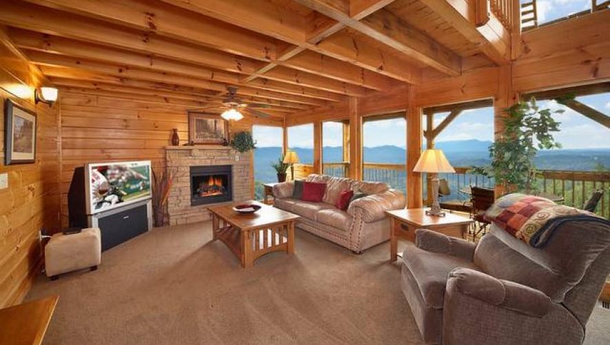 living room with large windows smoky mountain cabin