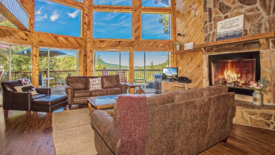 living room inside cabin with mountain views