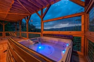 hot tub on the deck of cabin the lodge at coopers hawk